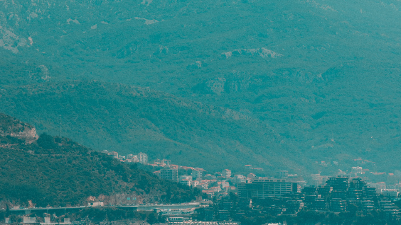 Green Mountains Near Body of Water During Daytime. Wallpaper in 1366x768 Resolution
