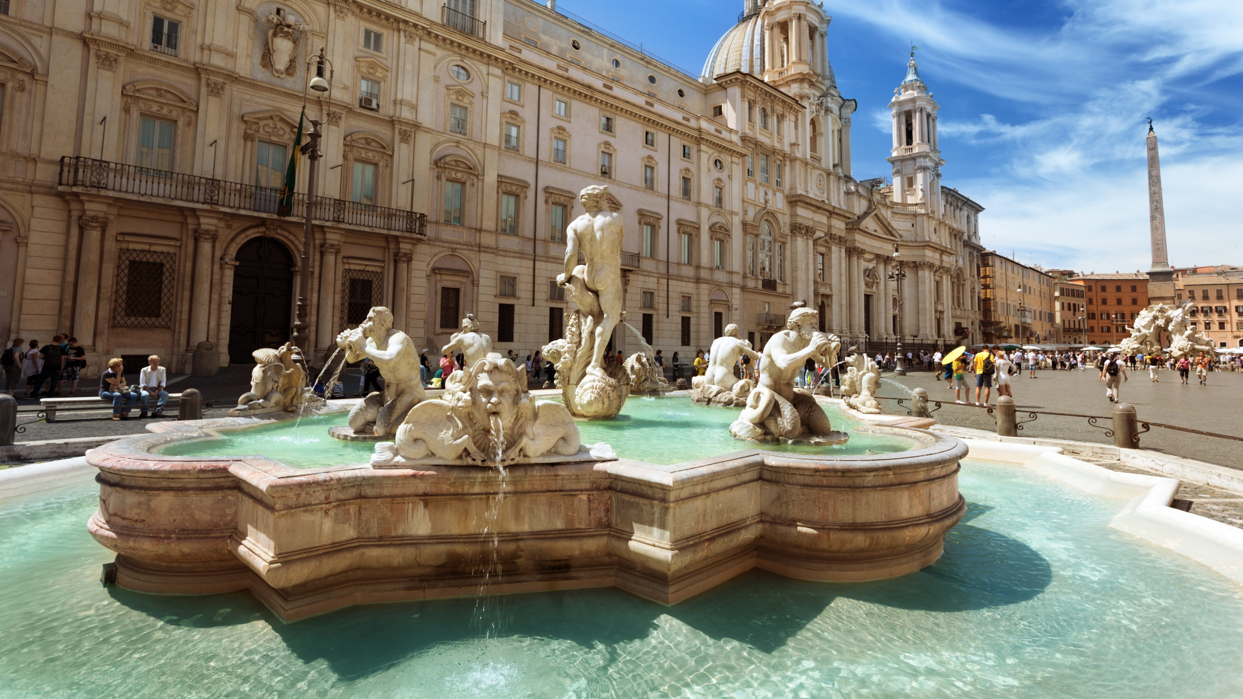 People in Swimming Pool Near Building During Daytime. Wallpaper in 2560x1440 Resolution