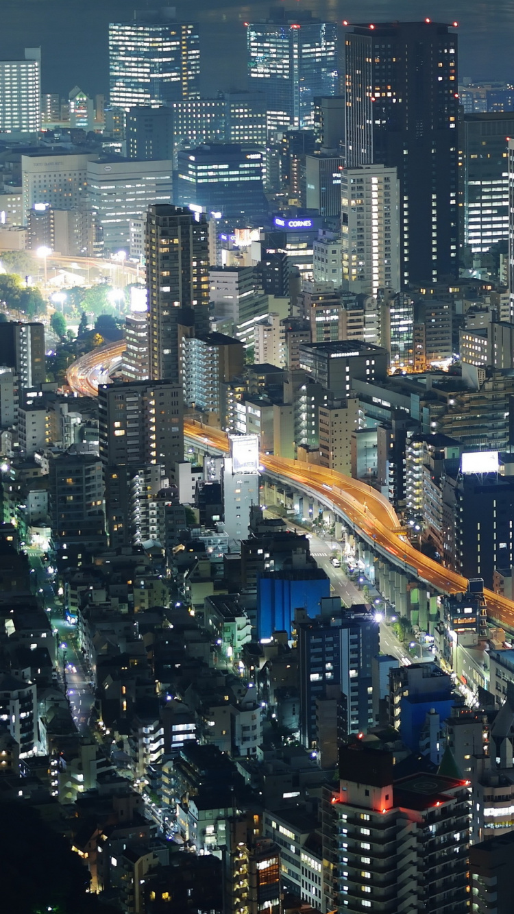 Vue Aérienne Des Bâtiments de la Ville Pendant la Nuit. Wallpaper in 750x1334 Resolution