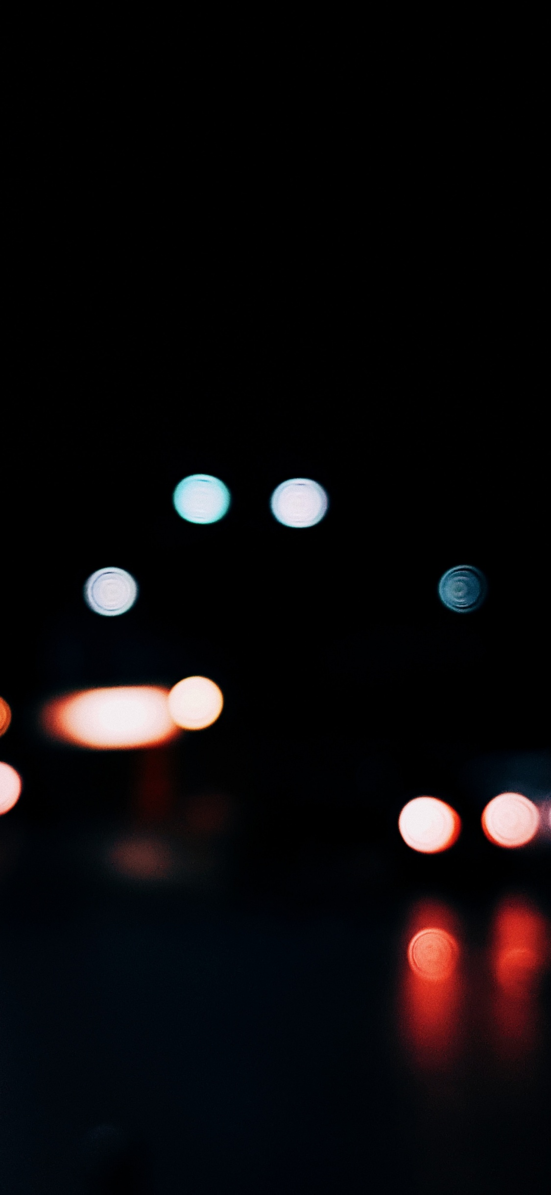 Bokeh-Fotografie Der Lichter Der Stadt Während Der Nacht. Wallpaper in 1125x2436 Resolution