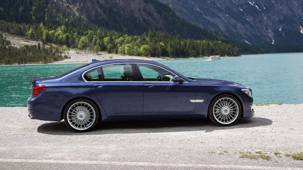 Black Sedan on Gray Asphalt Road During Daytime. Wallpaper in 1280x720 Resolution