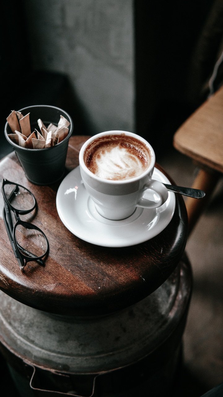White Ceramic Cup With Saucer on Brown Wooden Round Table. Wallpaper in 720x1280 Resolution