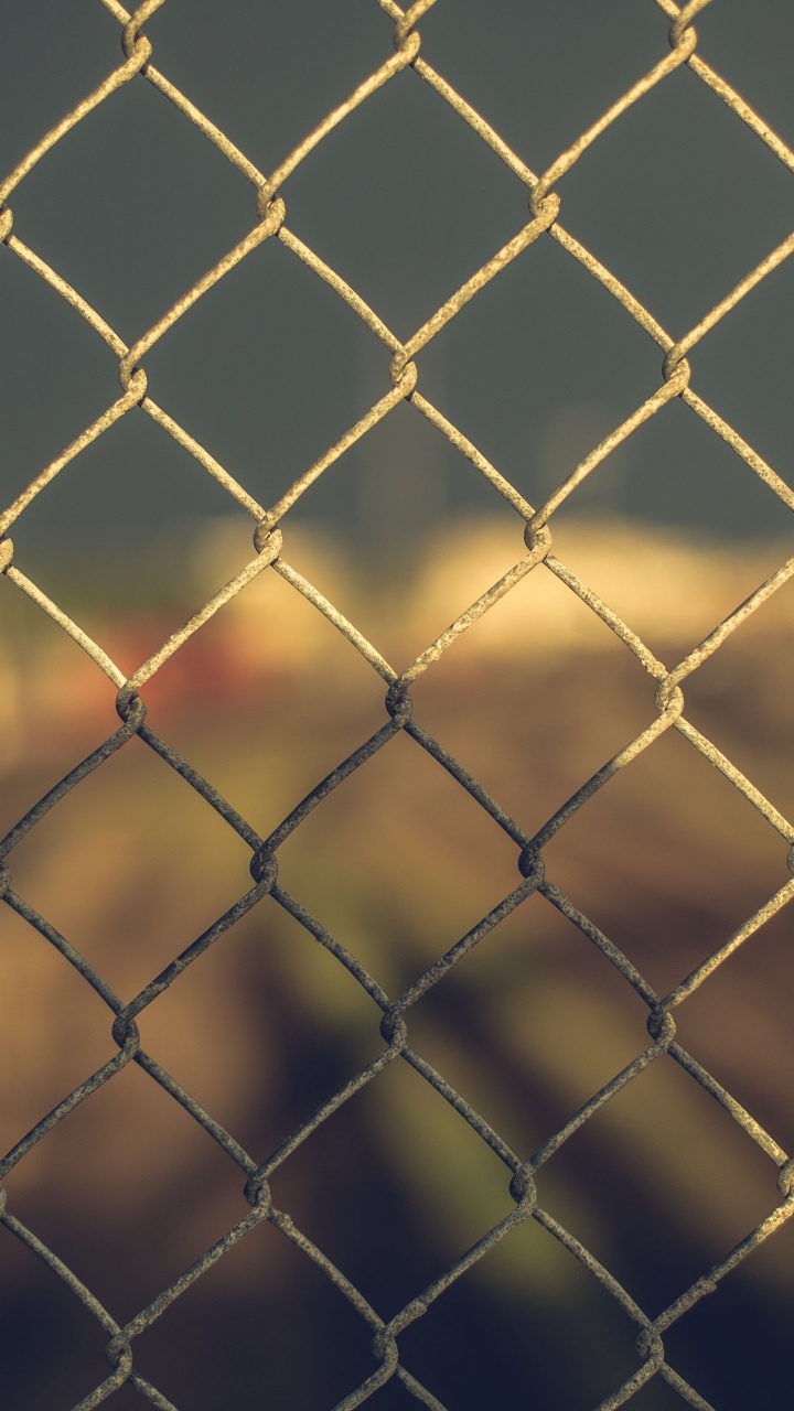 Download 720x1280 Wallpaper Grey Metal Fence With Yellow Light Grey Metal Fence With Yellow Light. Wallpaper in 720x1280 Resolution