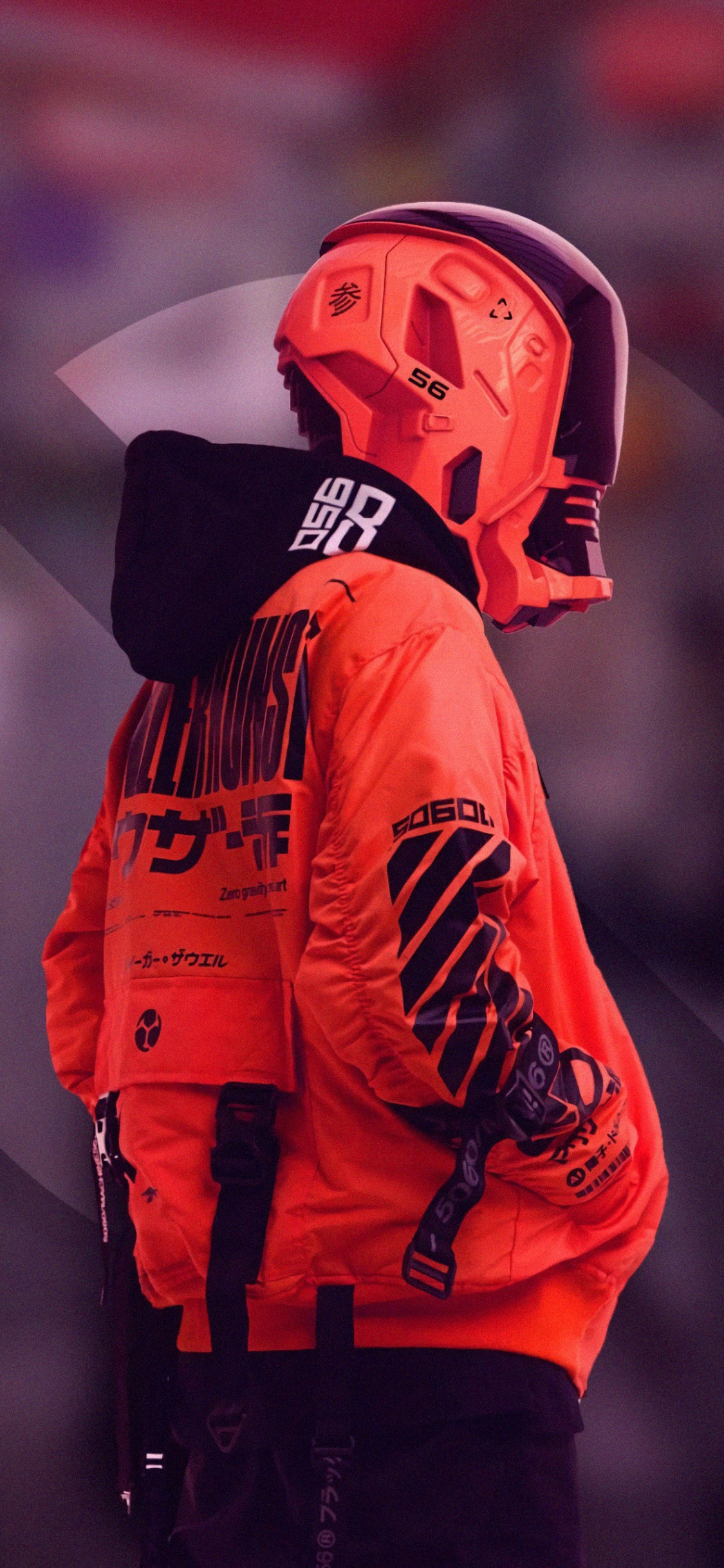 Man in Orange and Black Jacket Wearing Orange Helmet. Wallpaper in 1125x2436 Resolution