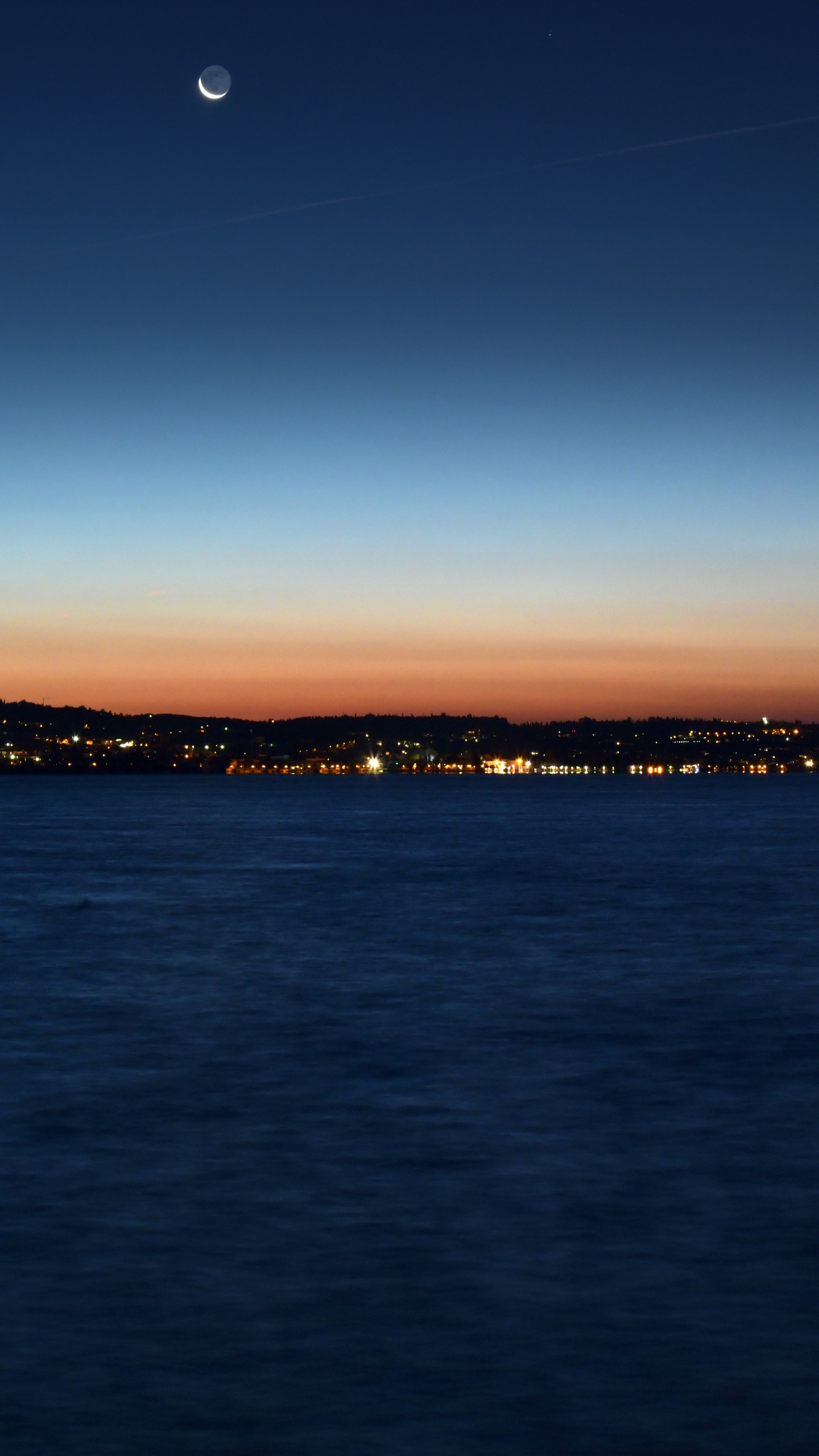 Body of Water Near Mountain During Sunset. Wallpaper in 1440x2560 Resolution