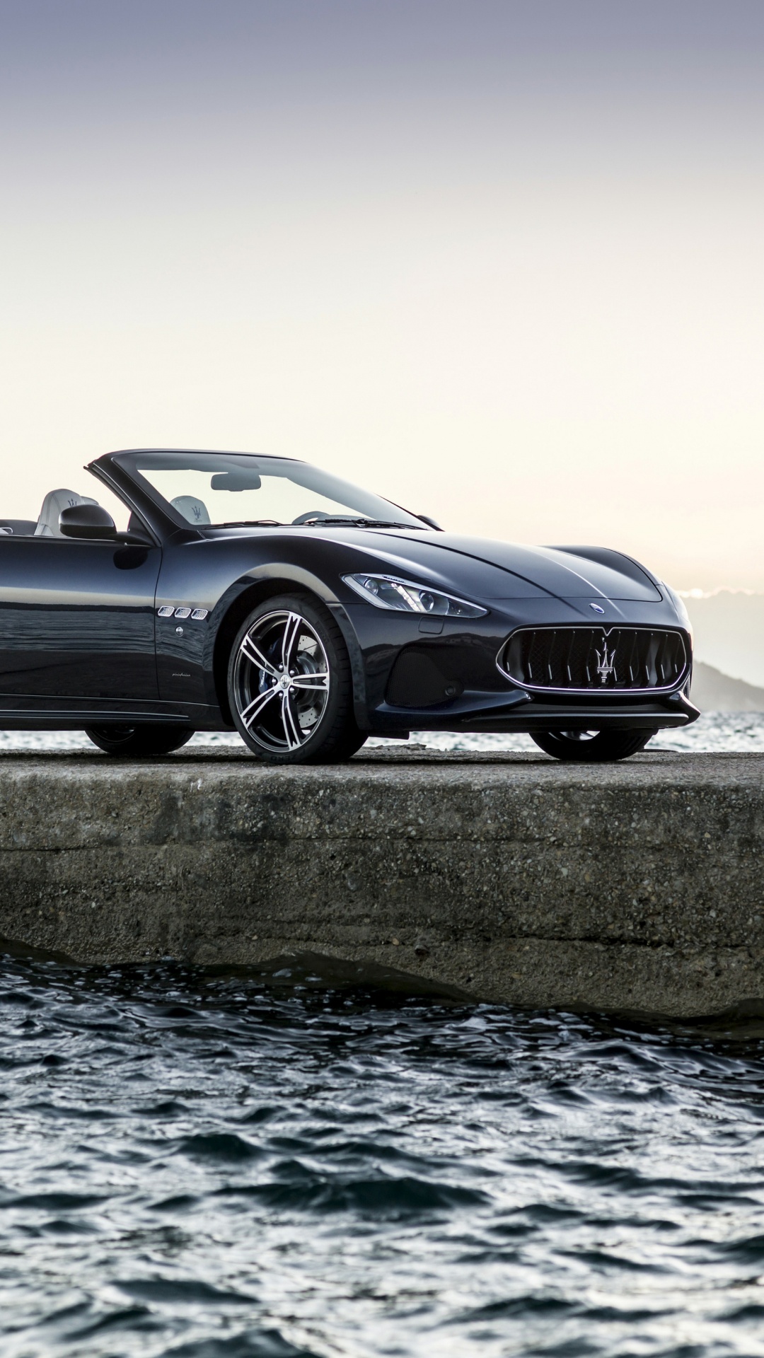 Black Coupe on Gray Concrete Road During Daytime. Wallpaper in 1080x1920 Resolution