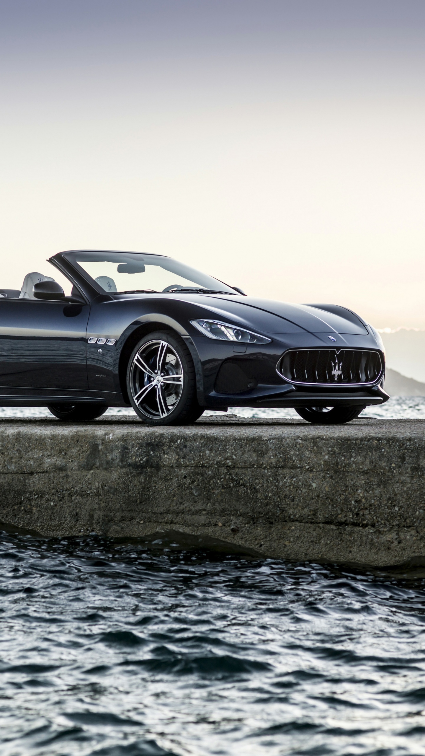 Black Coupe on Gray Concrete Road During Daytime. Wallpaper in 1440x2560 Resolution