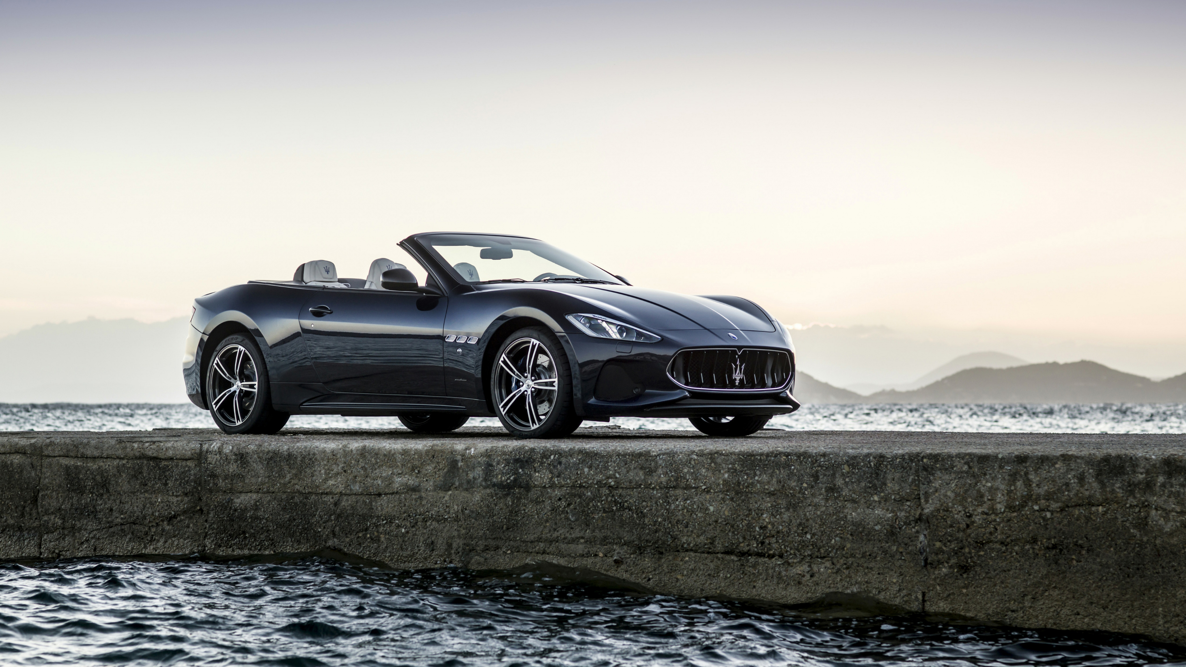 Black Coupe on Gray Concrete Road During Daytime. Wallpaper in 3840x2160 Resolution