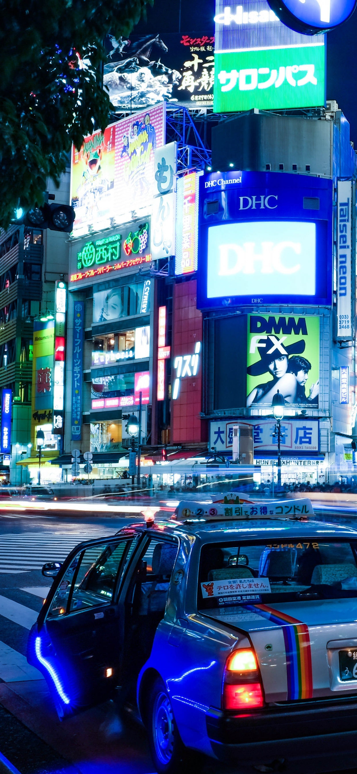 Cars on Road Near Buildings During Night Time. Wallpaper in 1242x2688 Resolution