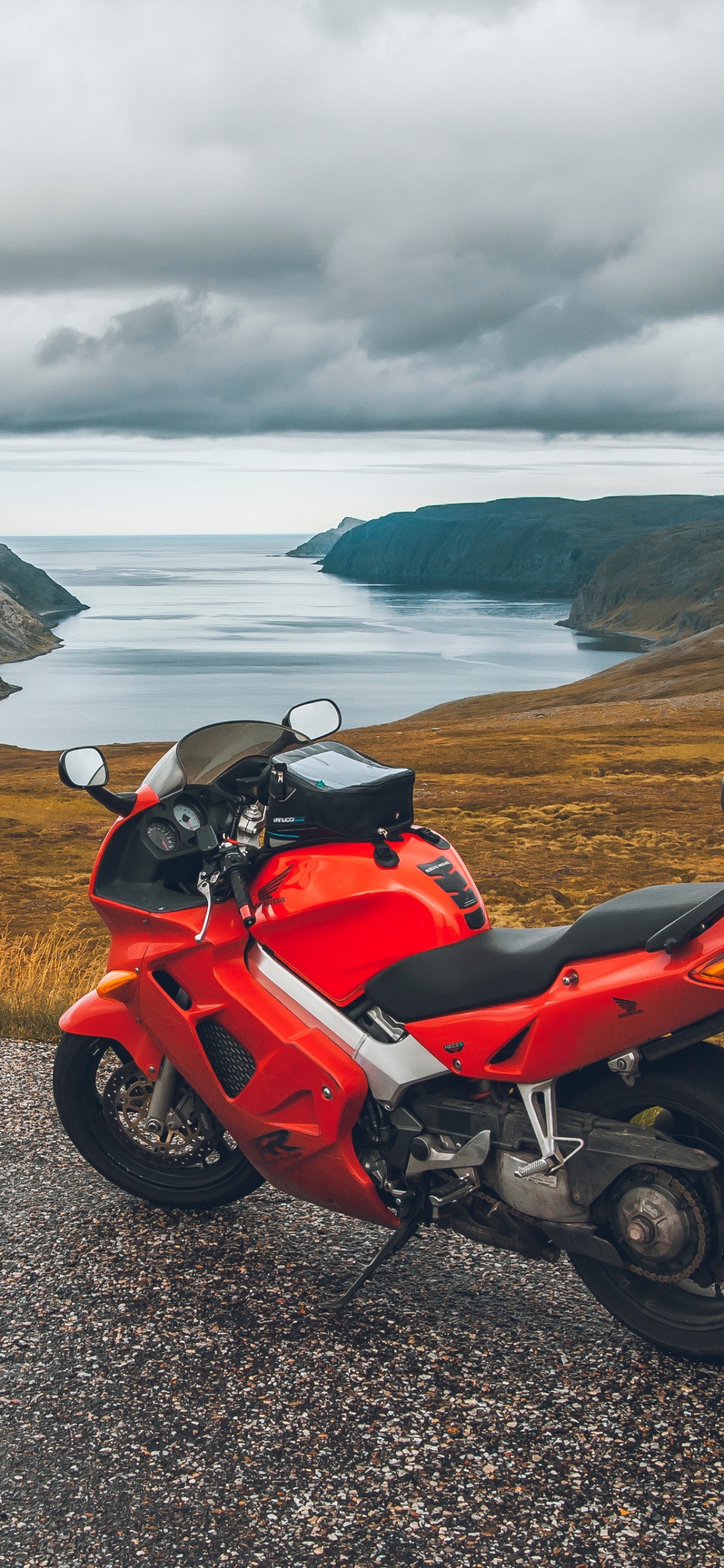 Red and Black Sports Bike Parked on Gray Asphalt Road During Daytime. Wallpaper in 1242x2688 Resolution