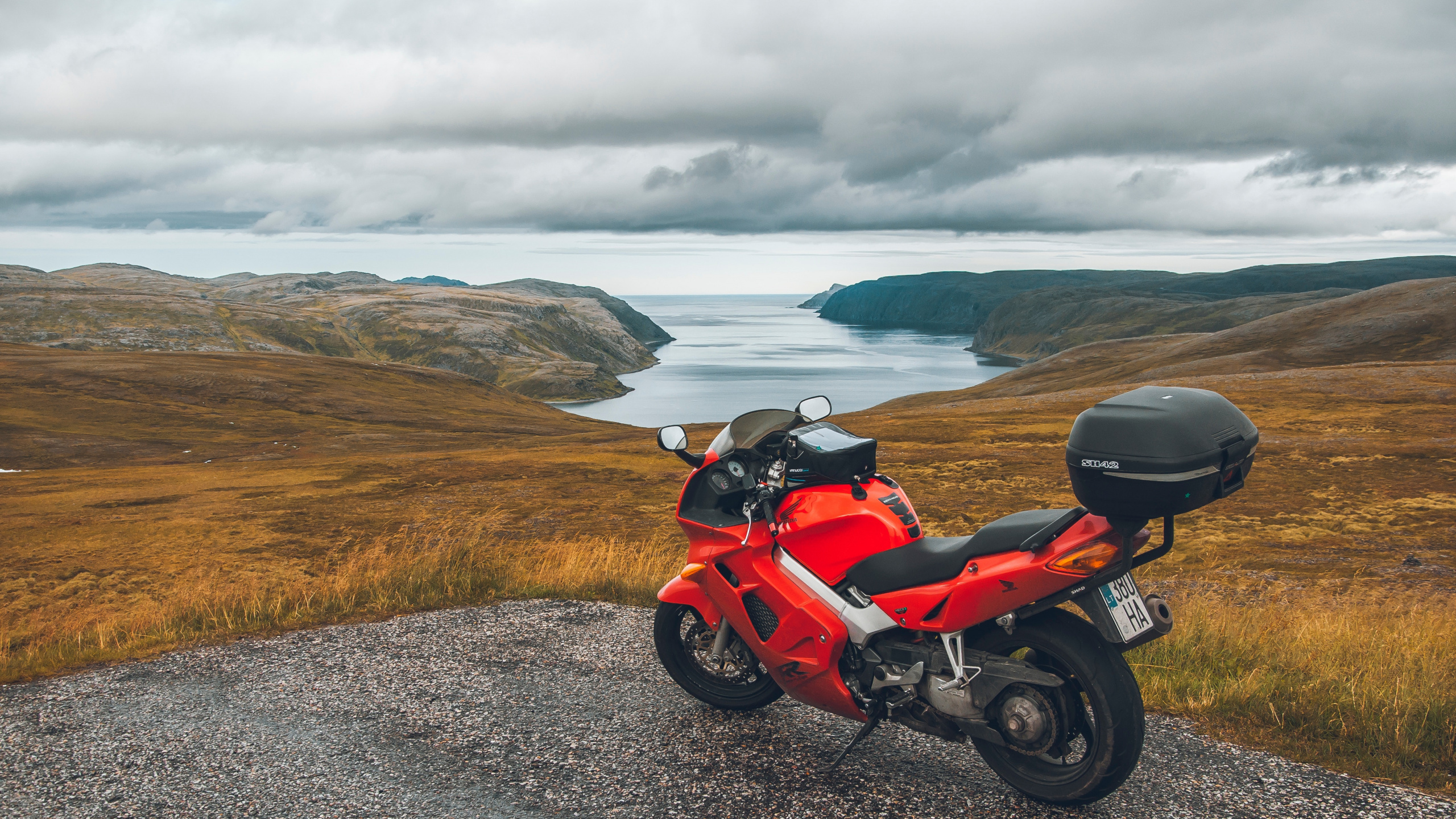 Red and Black Sports Bike Parked on Gray Asphalt Road During Daytime. Wallpaper in 2560x1440 Resolution