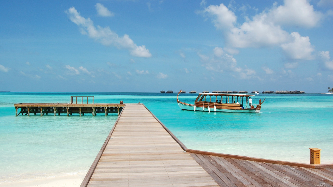 Brown Wooden Dock on Blue Sea Under Blue Sky and White Clouds During Daytime. Wallpaper in 1280x720 Resolution