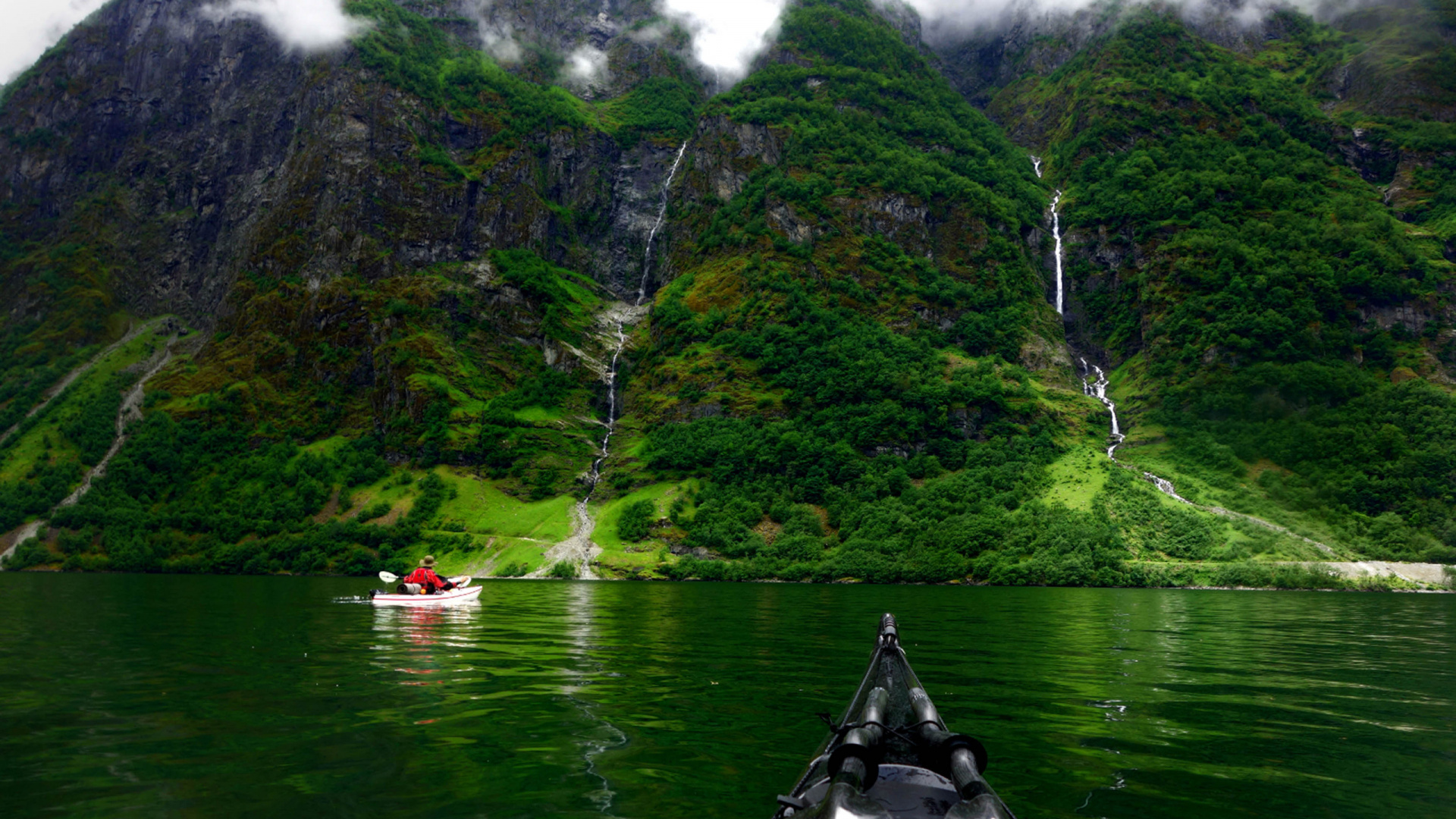 Black Boat on Body of Water Near Mountain During Daytime. Wallpaper in 1920x1080 Resolution