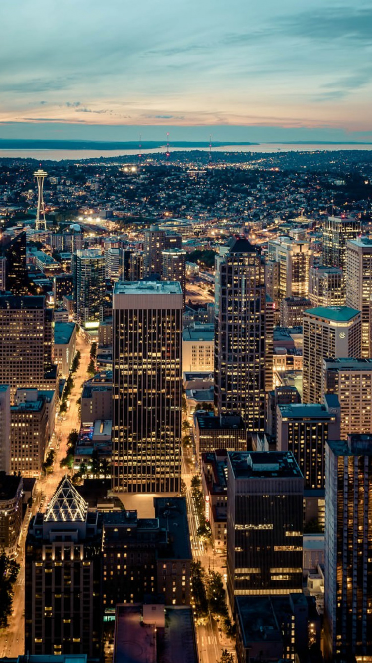 Aerial View of City Buildings During Night Time. Wallpaper in 750x1334 Resolution