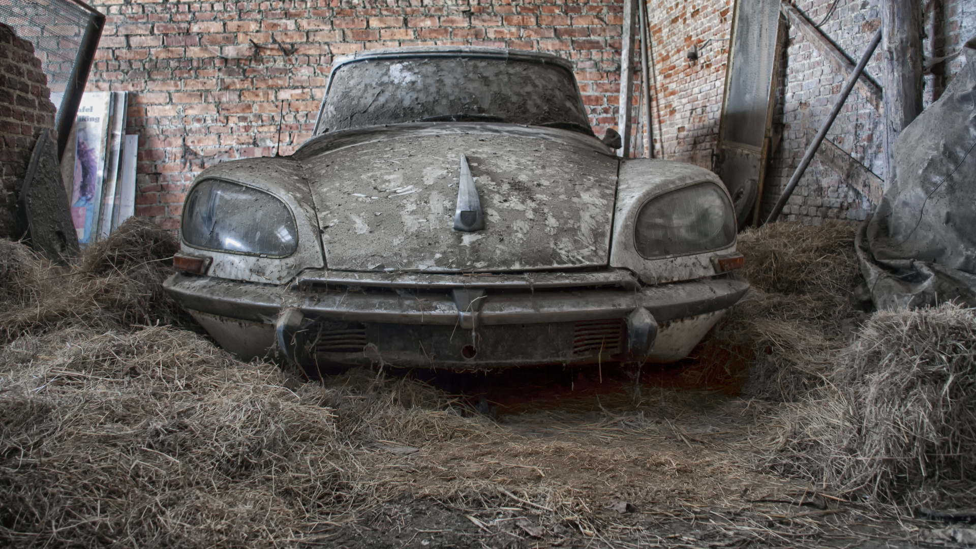 Classic White Car Parked Beside Brown Brick Wall. Wallpaper in 1920x1080 Resolution