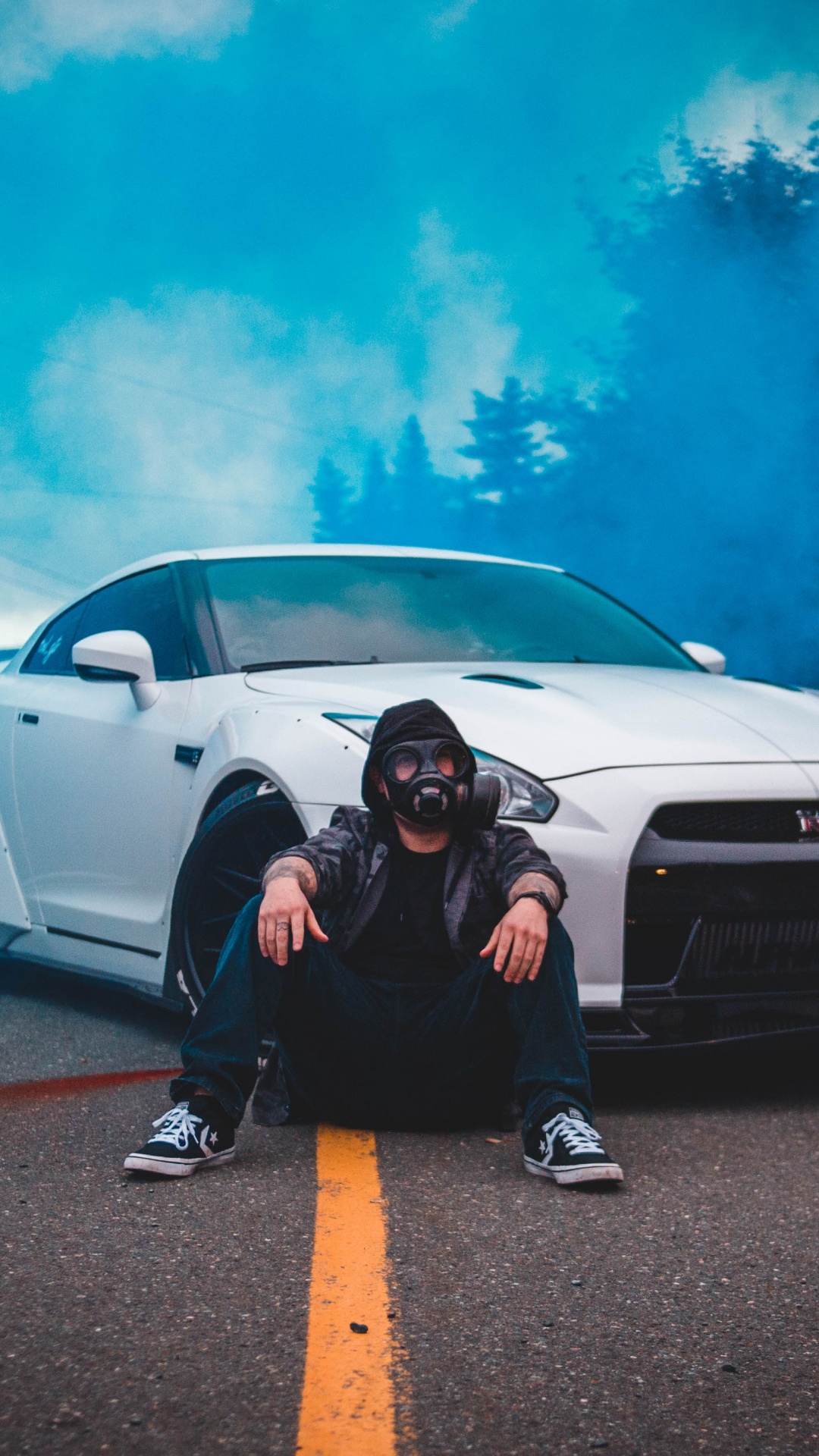 Man in Black Jacket Sitting Beside White Car. Wallpaper in 1080x1920 Resolution