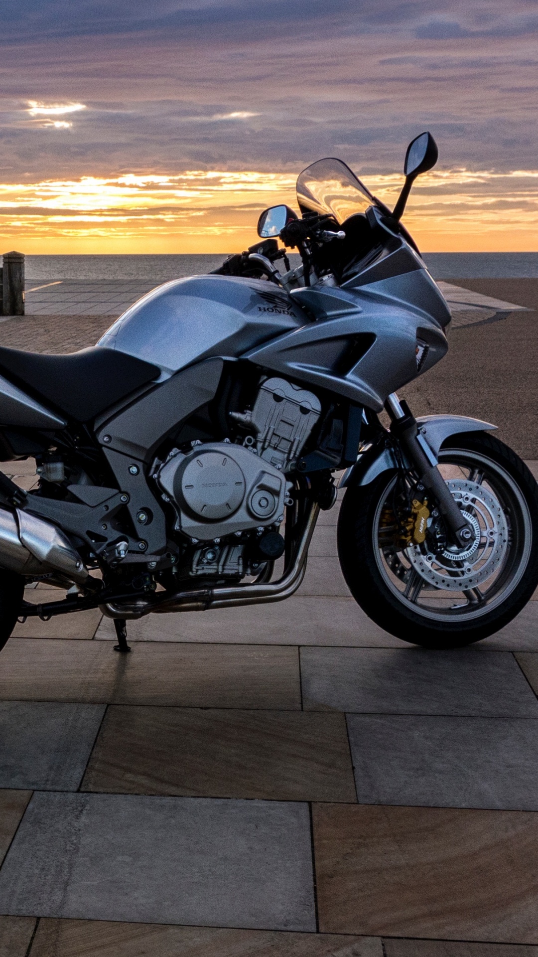 Black and Silver Cruiser Motorcycle on Gray Concrete Floor During Sunset. Wallpaper in 1080x1920 Resolution