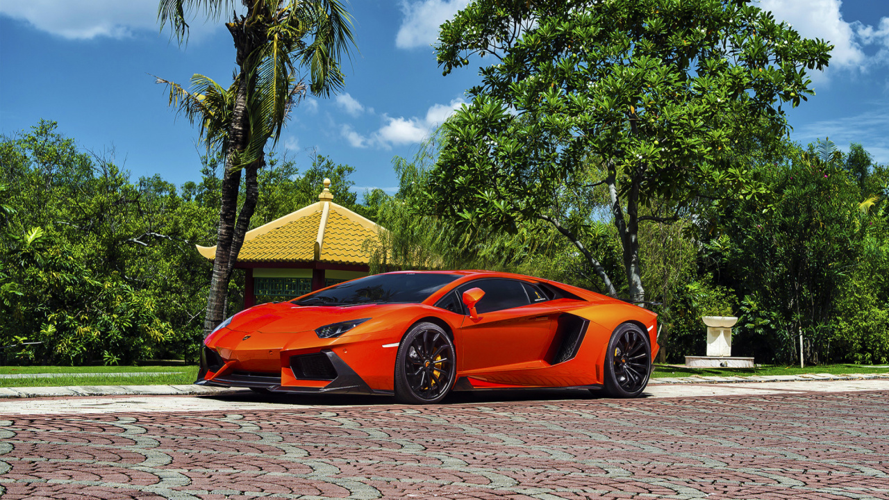 Orange Ferrari 458 Italia Parked on Gray Brick Pavement. Wallpaper in 1280x720 Resolution