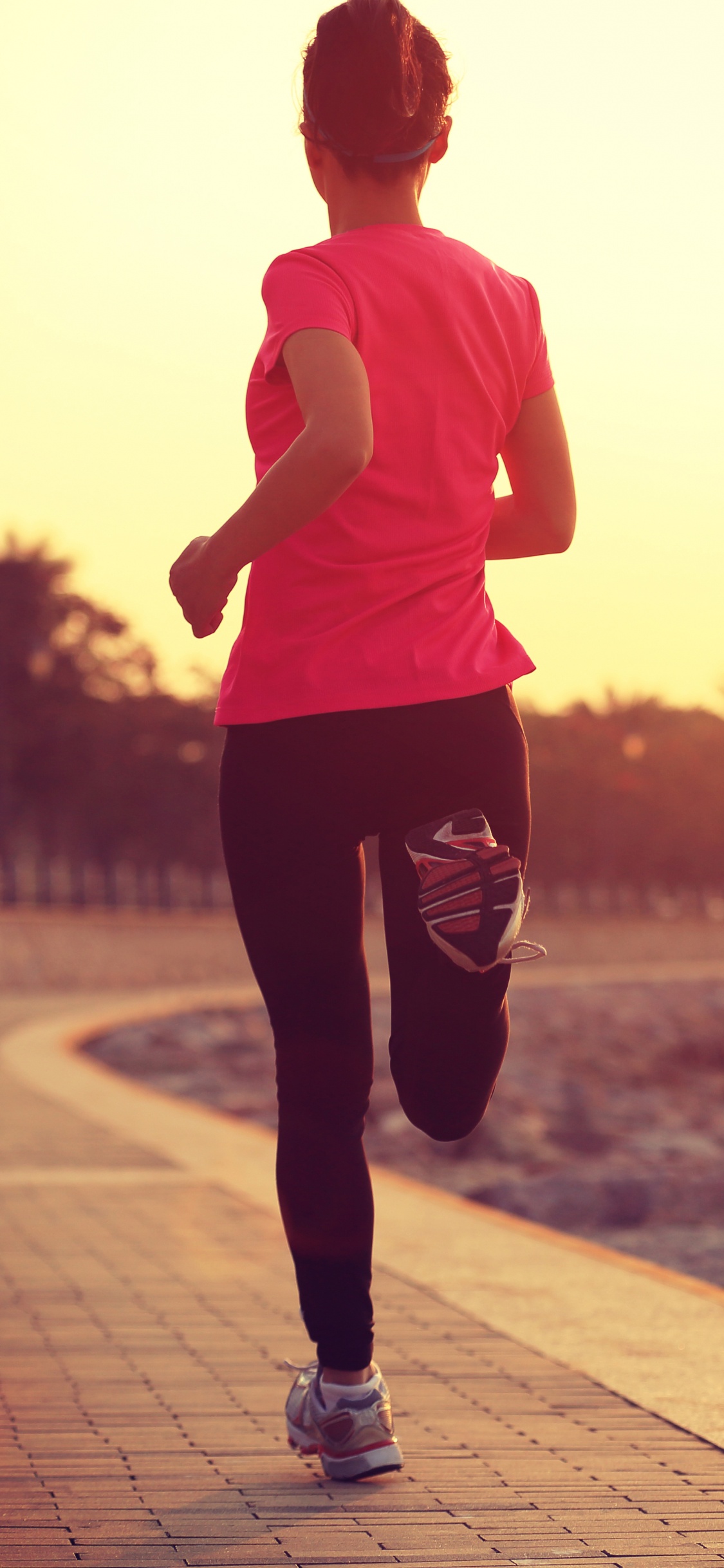 Man in Pink Crew Neck T-shirt and Black Pants Standing on Gray Concrete Pavement During. Wallpaper in 1125x2436 Resolution
