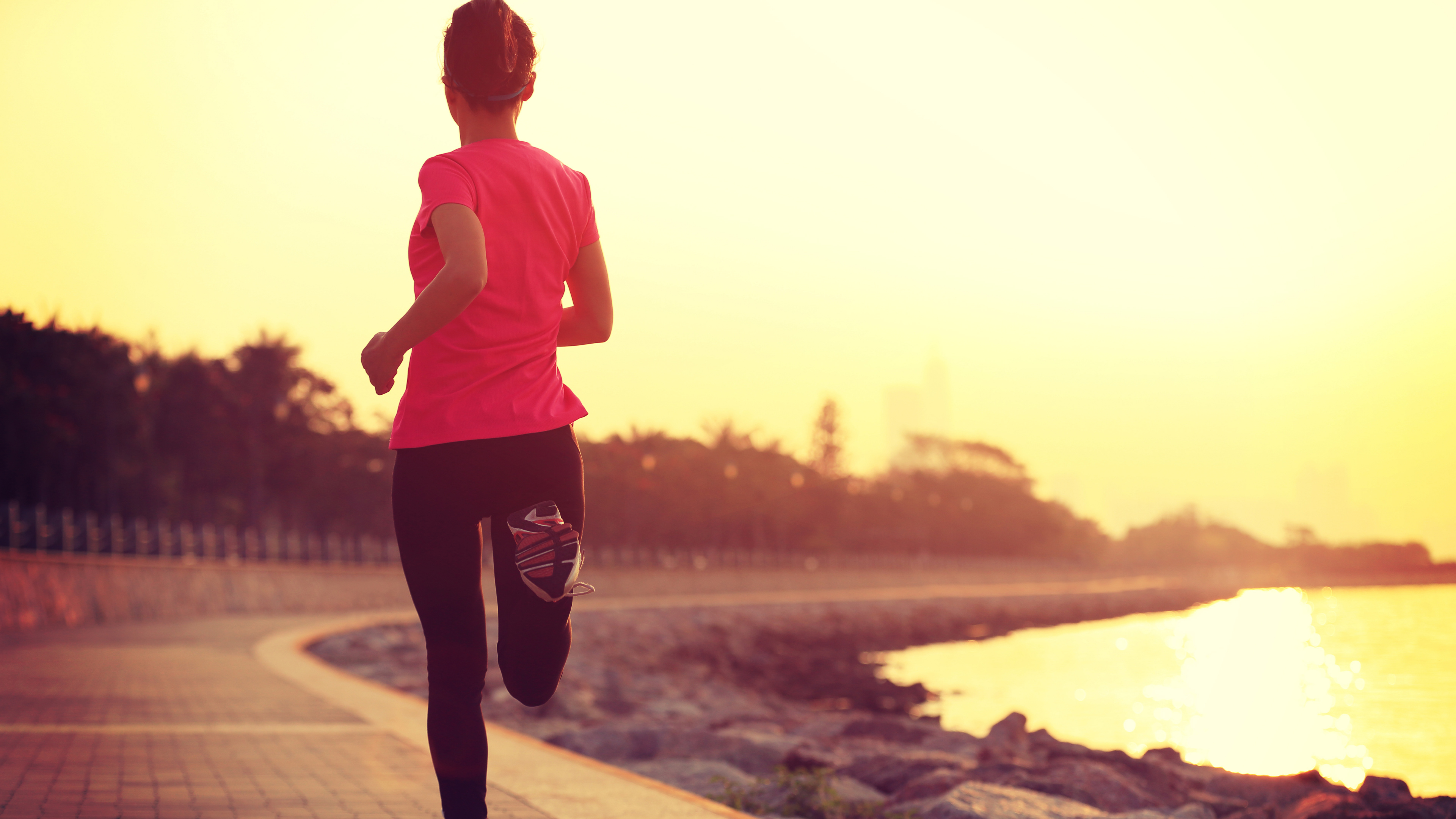 Man in Pink Crew Neck T-shirt and Black Pants Standing on Gray Concrete Pavement During. Wallpaper in 3840x2160 Resolution