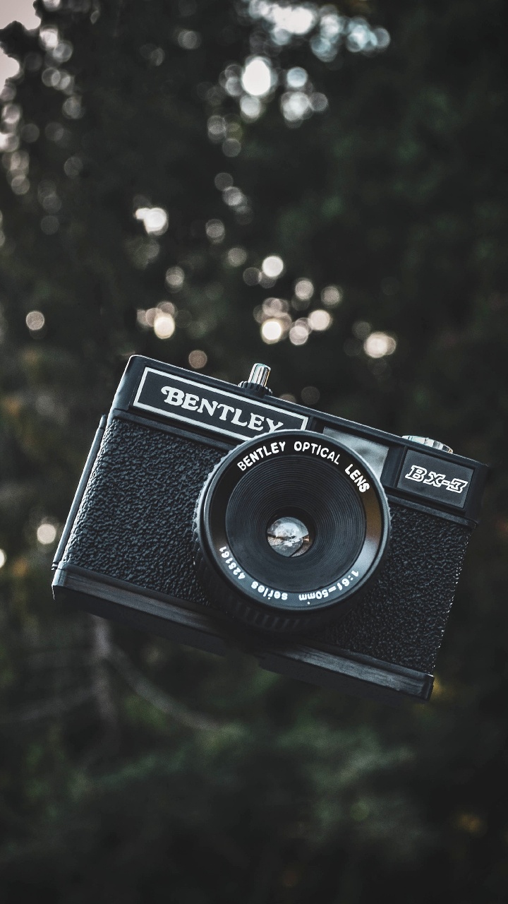 Appareil Photo Nikon Noir et Argent. Wallpaper in 720x1280 Resolution