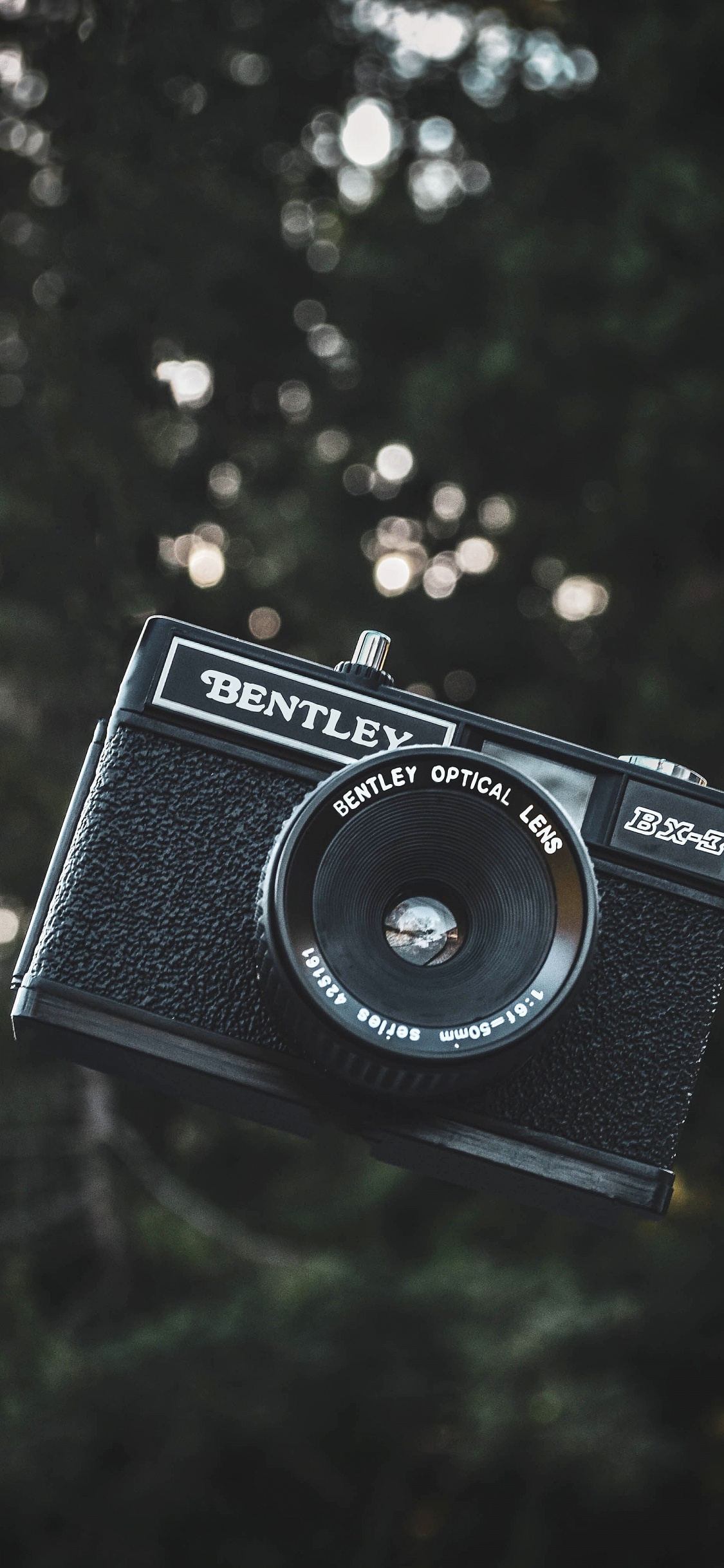 Cámara Nikon Negra y Plateada. Wallpaper in 1125x2436 Resolution