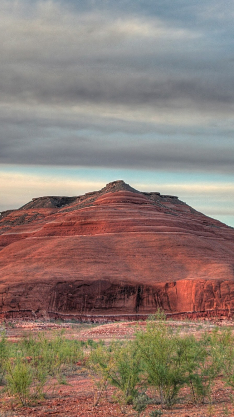 Brown Mountain Under Cloudy Sky During Daytime. Wallpaper in 750x1334 Resolution