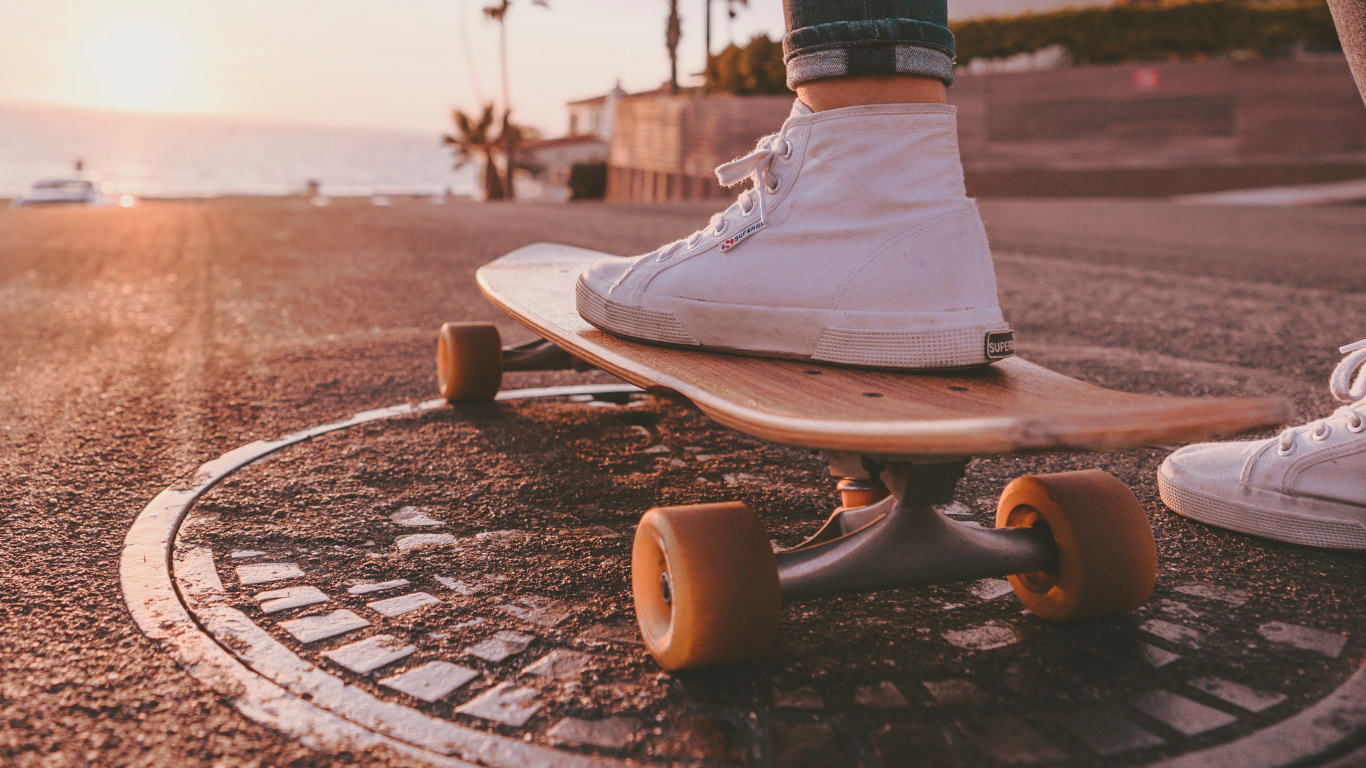 Person in Blue Denim Jeans and White Nike Sneakers Standing on Brown Concrete Floor During Daytime. Wallpaper in 1366x768 Resolution