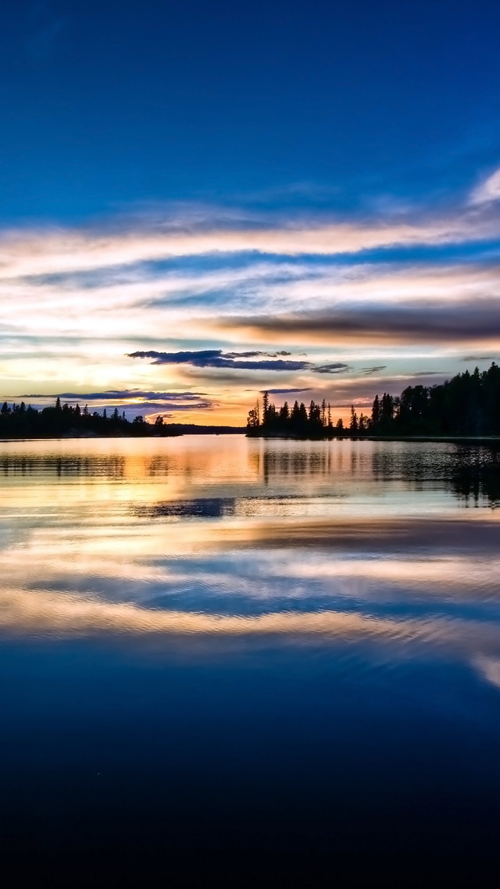 Body of Water Near Trees Under Blue Sky During Daytime. Wallpaper in 720x1280 Resolution