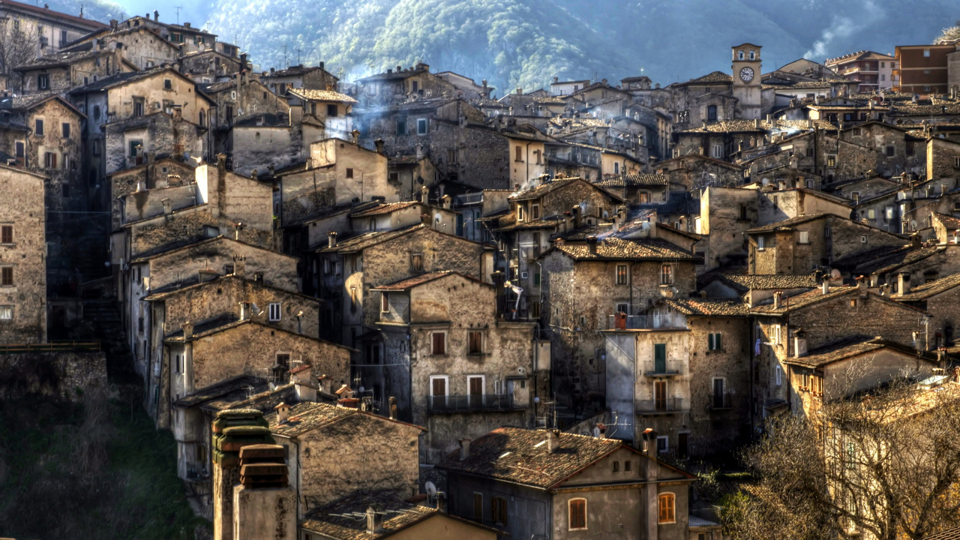 Brown Concrete Building Near Mountain During Daytime. Wallpaper in 1920x1080 Resolution