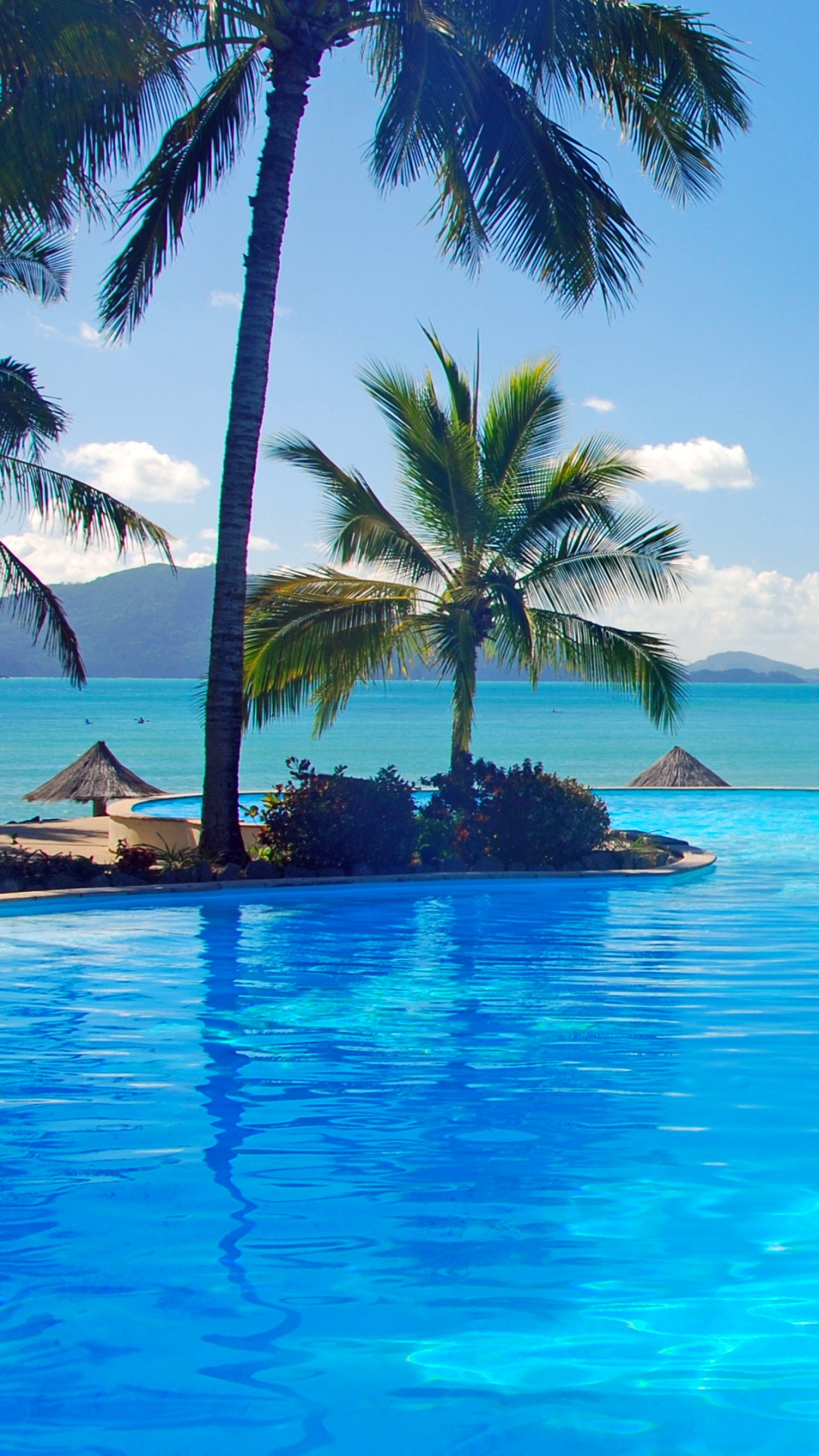 White and Brown Wooden House Near Body of Water During Daytime. Wallpaper in 1080x1920 Resolution