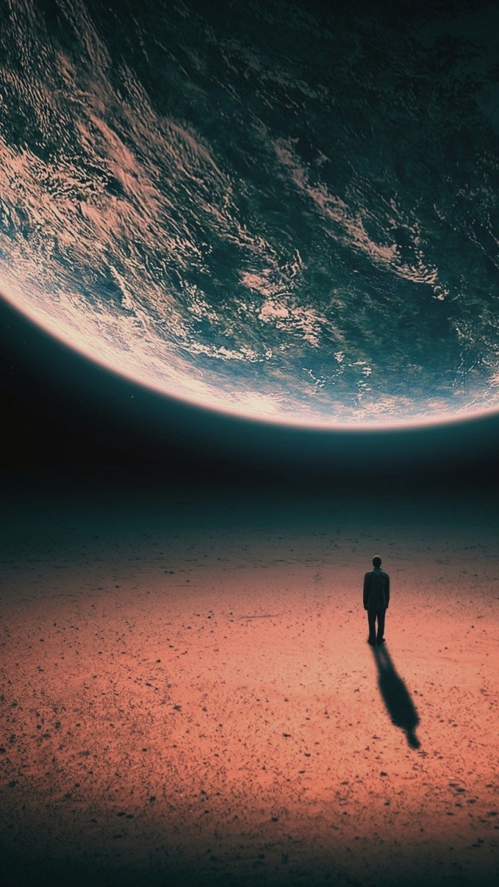 Personne en Veste Noire et Pantalon Noir Debout Sur du Sable Brun Pendant la Journée. Wallpaper in 720x1280 Resolution