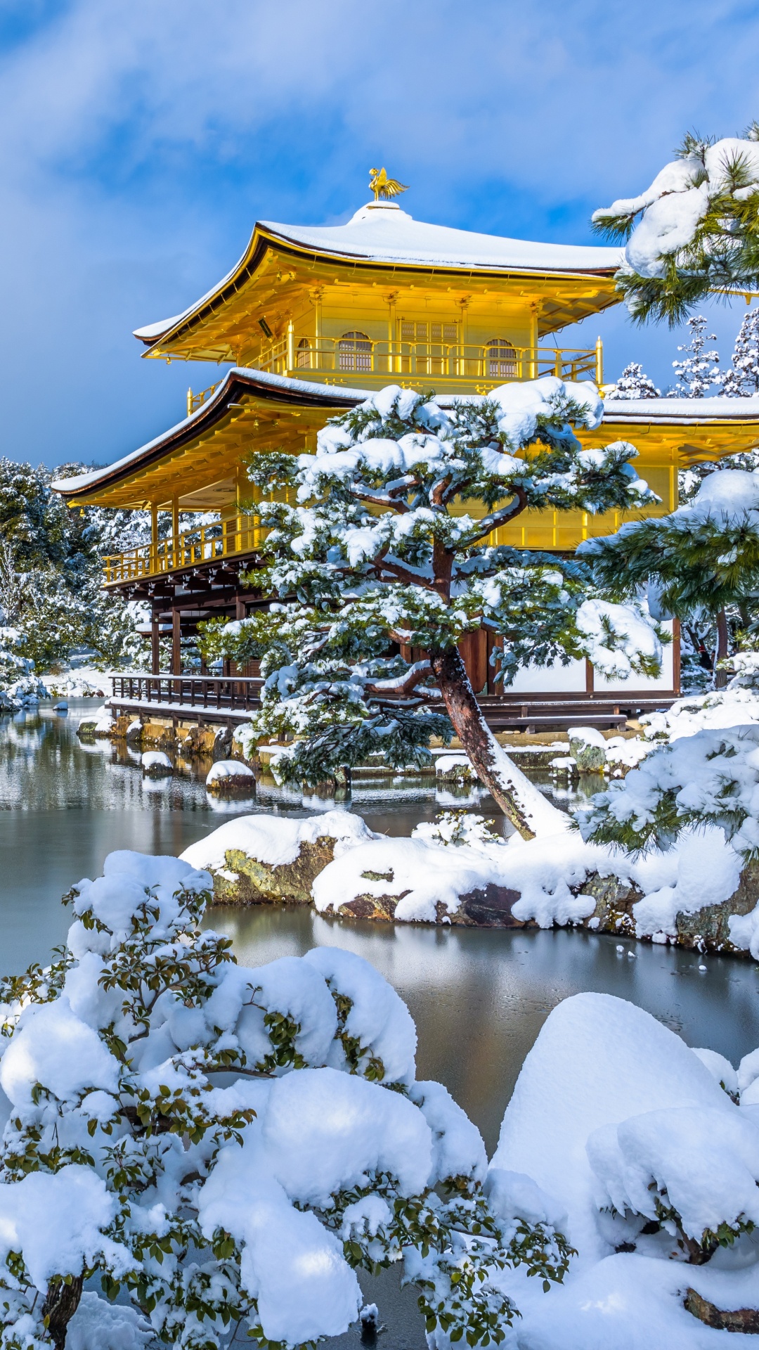 Brown and White Temple Near Body of Water Under Blue Sky During Daytime. Wallpaper in 1080x1920 Resolution