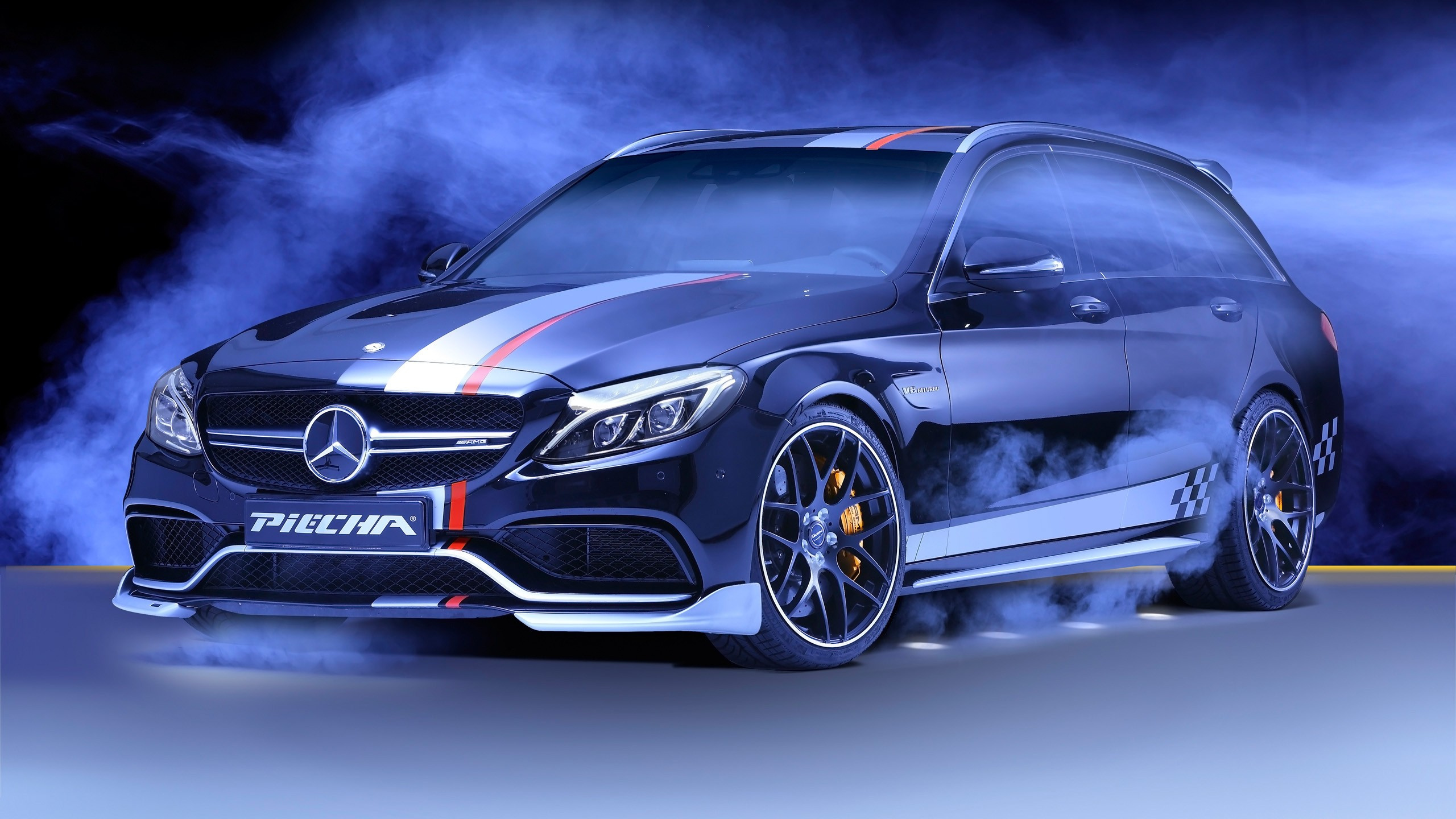 Black Mercedes Benz Coupe on Snow Covered Ground. Wallpaper in 2560x1440 Resolution