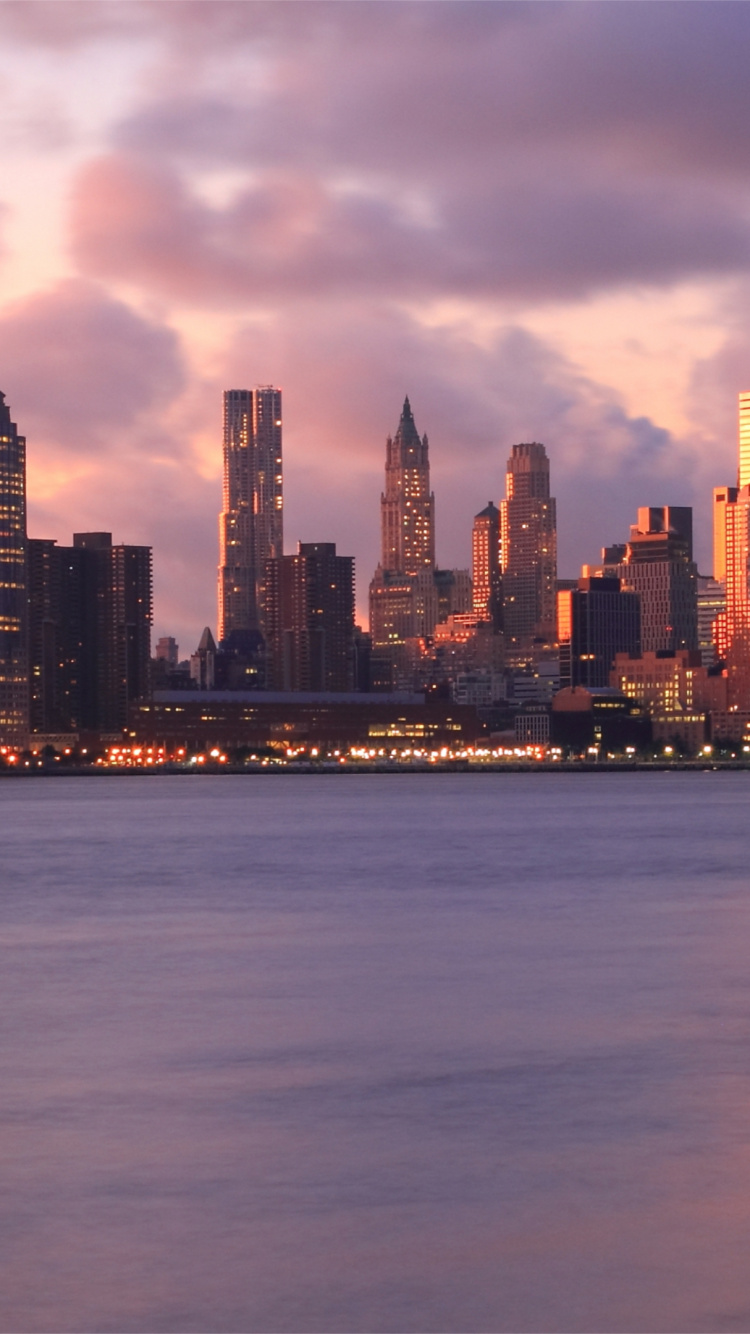 City Skyline Under Gray Cloudy Sky During Daytime. Wallpaper in 750x1334 Resolution