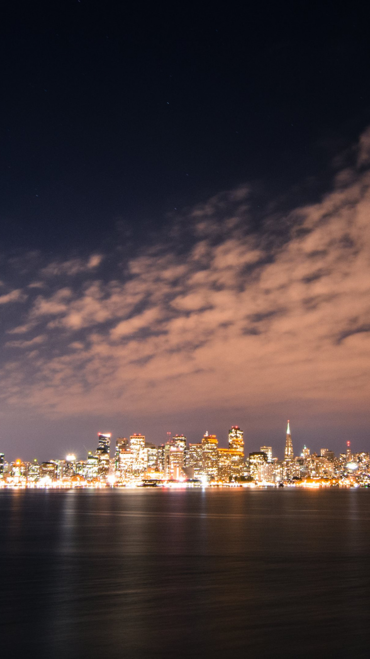 City Lights Turned on During Night Time. Wallpaper in 750x1334 Resolution