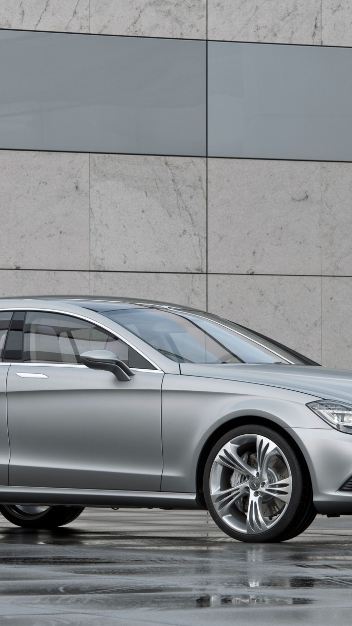 Silver Mercedes Benz Coupe Parked Beside Brown Wall. Wallpaper in 720x1280 Resolution