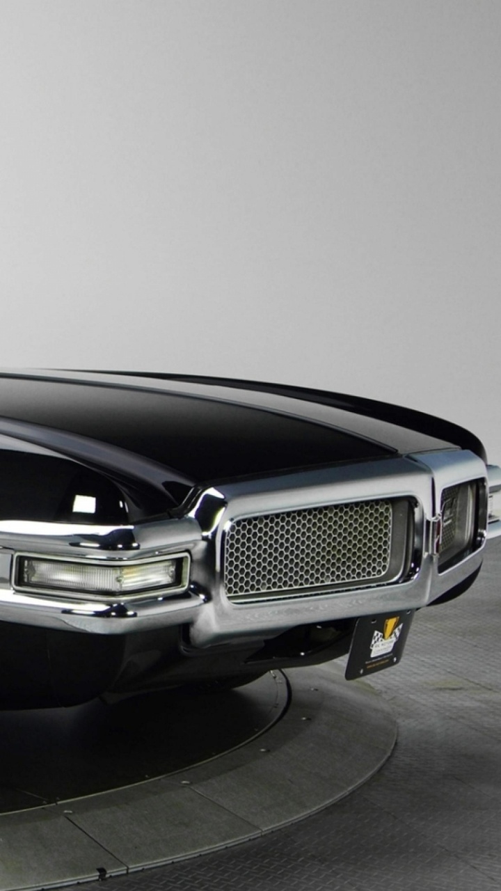 Porsche 911 Negro Estacionado Sobre Pavimento Gris. Wallpaper in 720x1280 Resolution