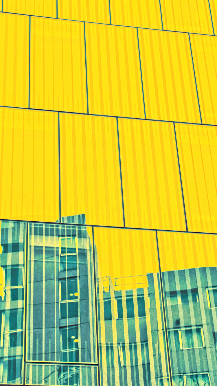 Gelb-graues Hochhaus. Wallpaper in 750x1334 Resolution