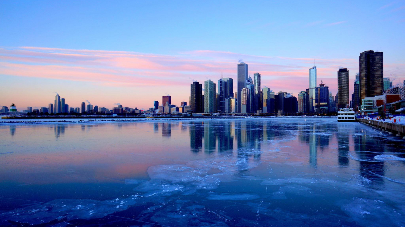 City Skyline Across Body of Water During Daytime. Wallpaper in 1366x768 Resolution
