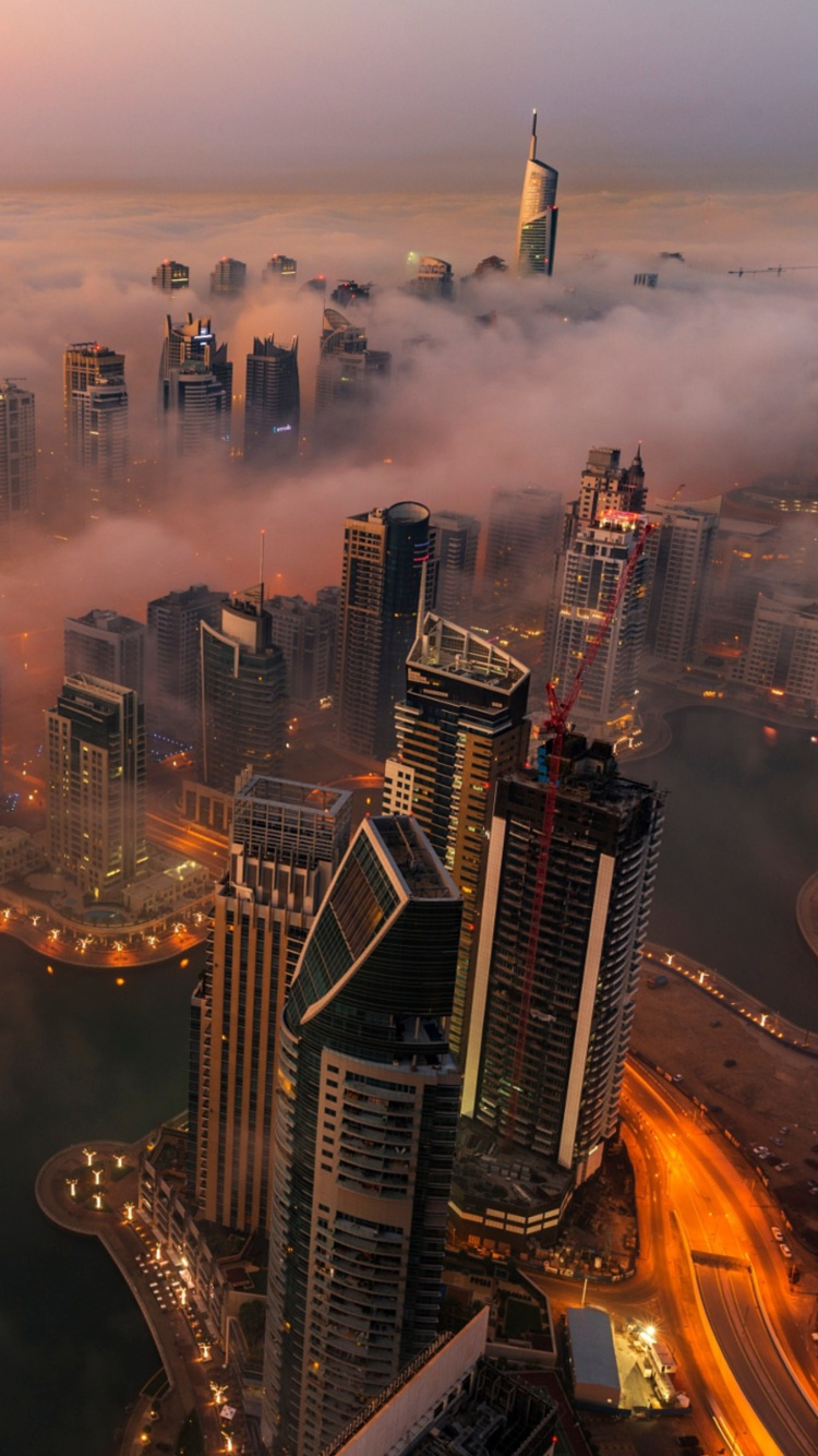 Aerial View of City Buildings During Night Time. Wallpaper in 750x1334 Resolution