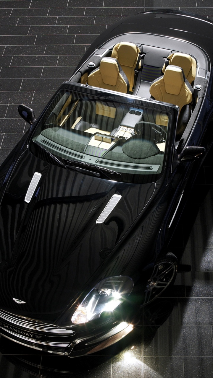 Black Porsche 911 Parked on Grey Brick Floor. Wallpaper in 720x1280 Resolution