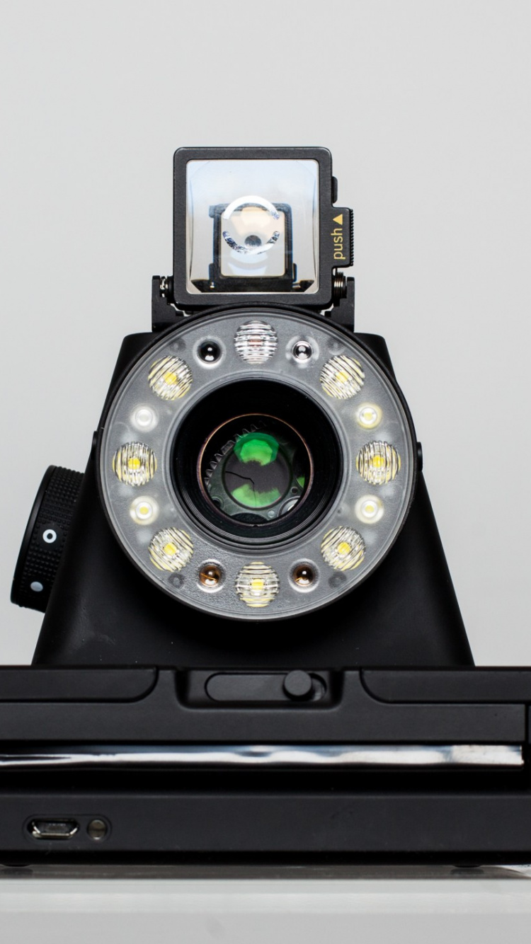 Black and Silver Camera on White Table. Wallpaper in 750x1334 Resolution