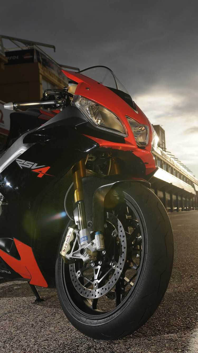 Red and Black Sports Bike Parked on Gray Concrete Floor During Daytime. Wallpaper in 750x1334 Resolution