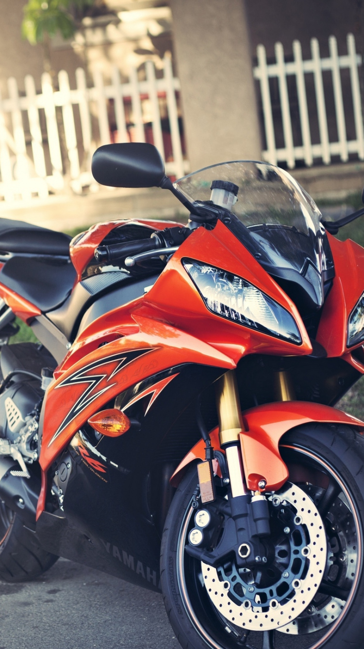 Orange and Black Sports Bike Parked on Road During Daytime. Wallpaper in 750x1334 Resolution