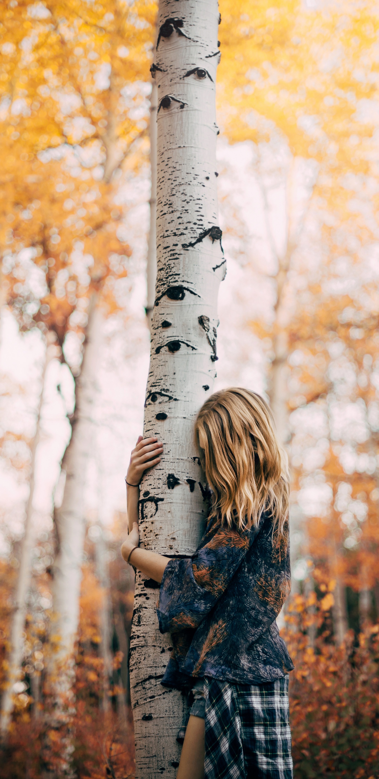Woman in Black and White Plaid Coat Standing Near White Tree During Daytime. Wallpaper in 1440x2960 Resolution