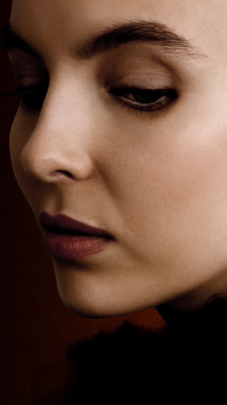 Woman in Black Shirt With Silver Earrings. Wallpaper in 750x1334 Resolution