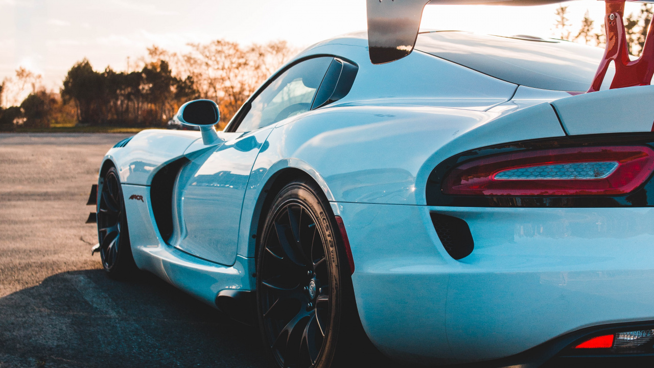 Blue and Black Sports Car on Road During Daytime. Wallpaper in 1280x720 Resolution