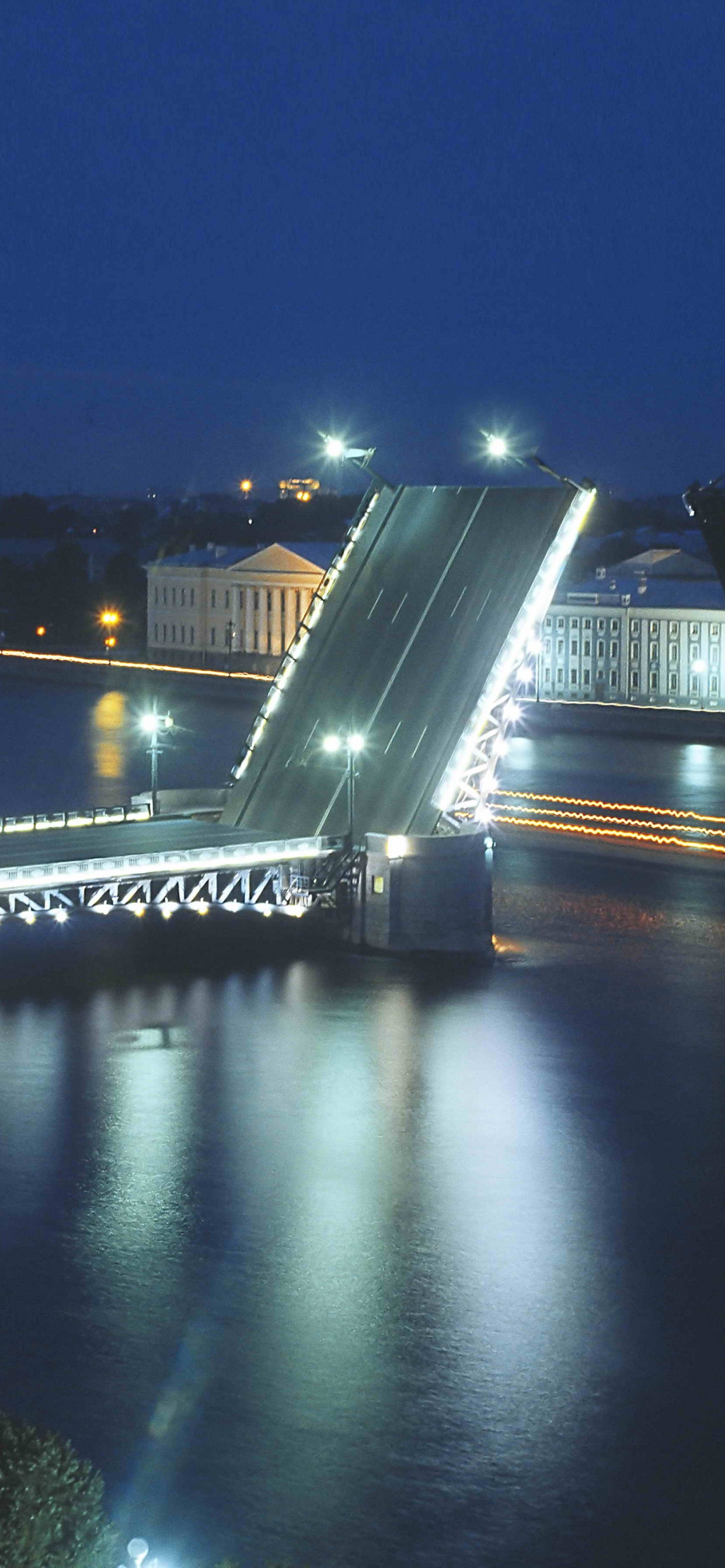 Bridge Over River During Night Time. Wallpaper in 1242x2688 Resolution