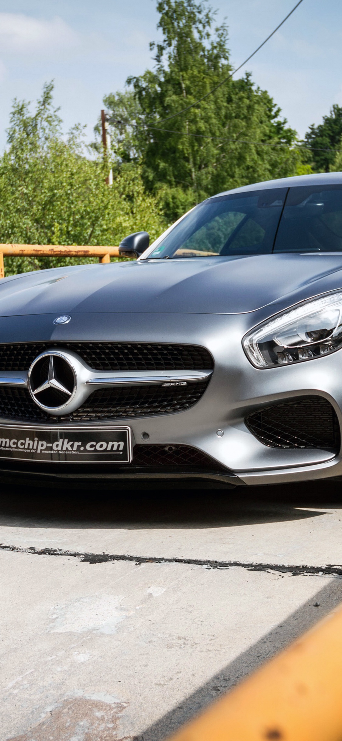 Black Mercedes Benz Coupe Parked on Gray Concrete Pavement During Daytime. Wallpaper in 1125x2436 Resolution